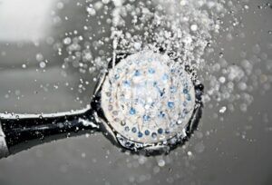shower head with water coming out.